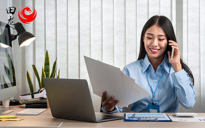 A corporate secretary performing tasks at their desk