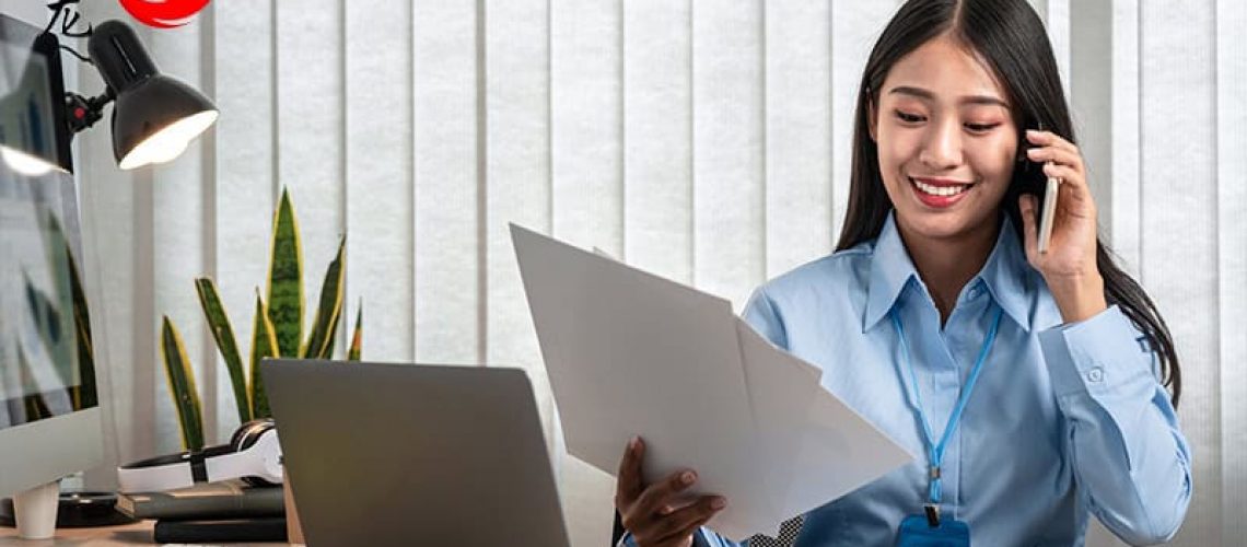 A corporate secretary performing tasks at their desk